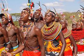 Community members in traditional attire taking part in a cultural celebration.